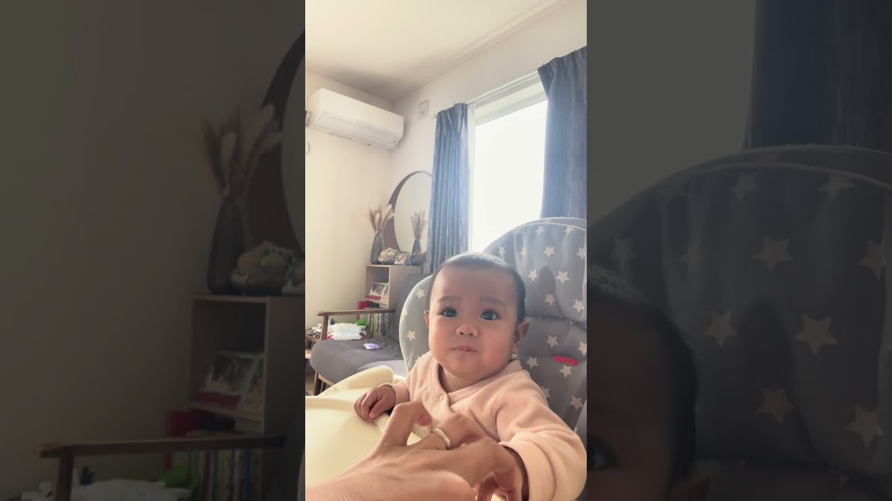 Aiyah eating baby snack  @ 6 mos 3 weeks 