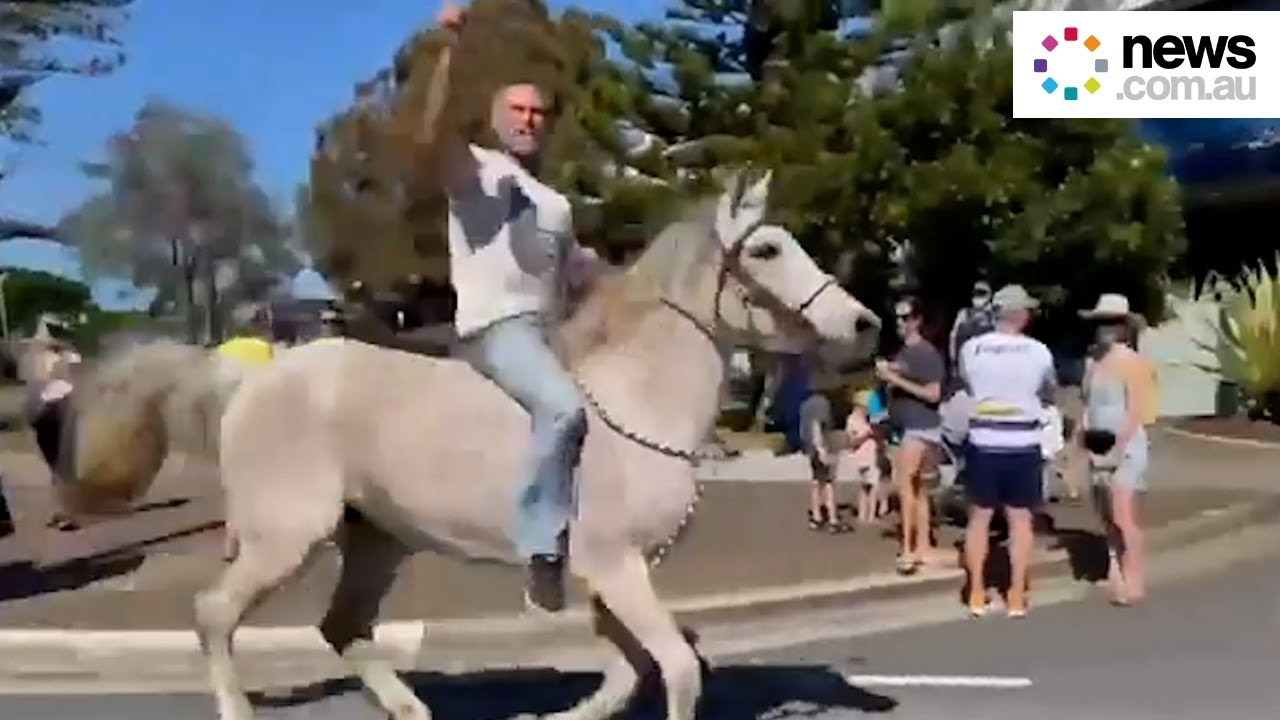 Man rides horse into anti-lockdown protest