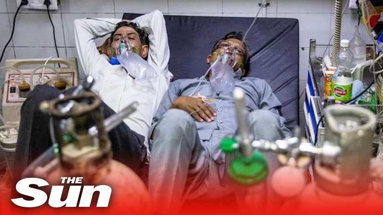 Two to a bed in Delhi hospital as India's COVID-19 crisis spirals out of control