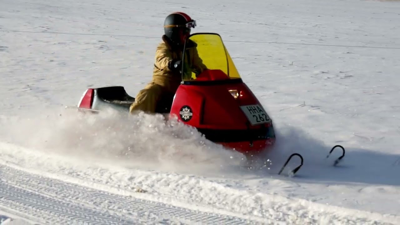 A 1974 Sno-Tric Vintage Snowmobile in Action