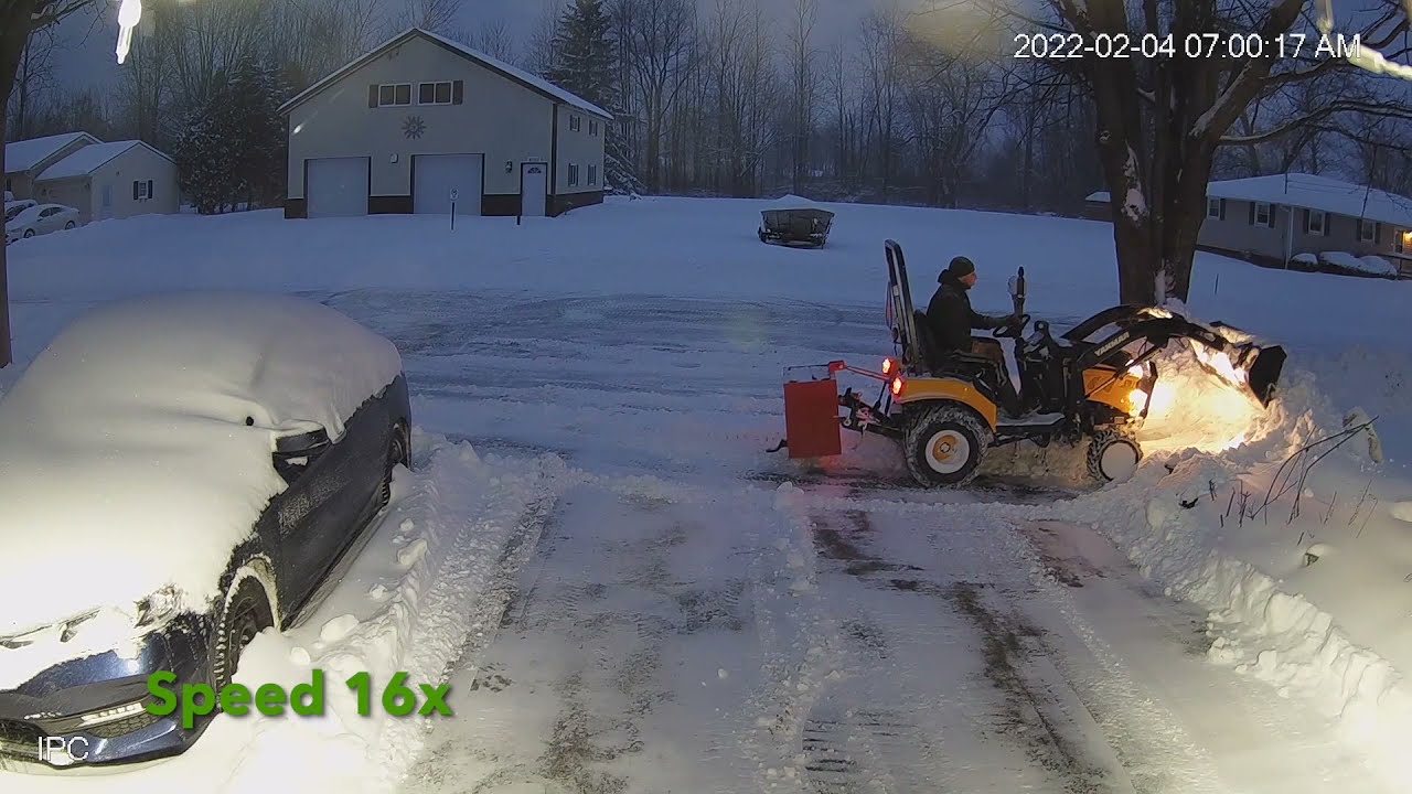 Yanmar Cub Cadet Sc2400 Sub compact tractor plowing snow with loader, 1 foot deep snow