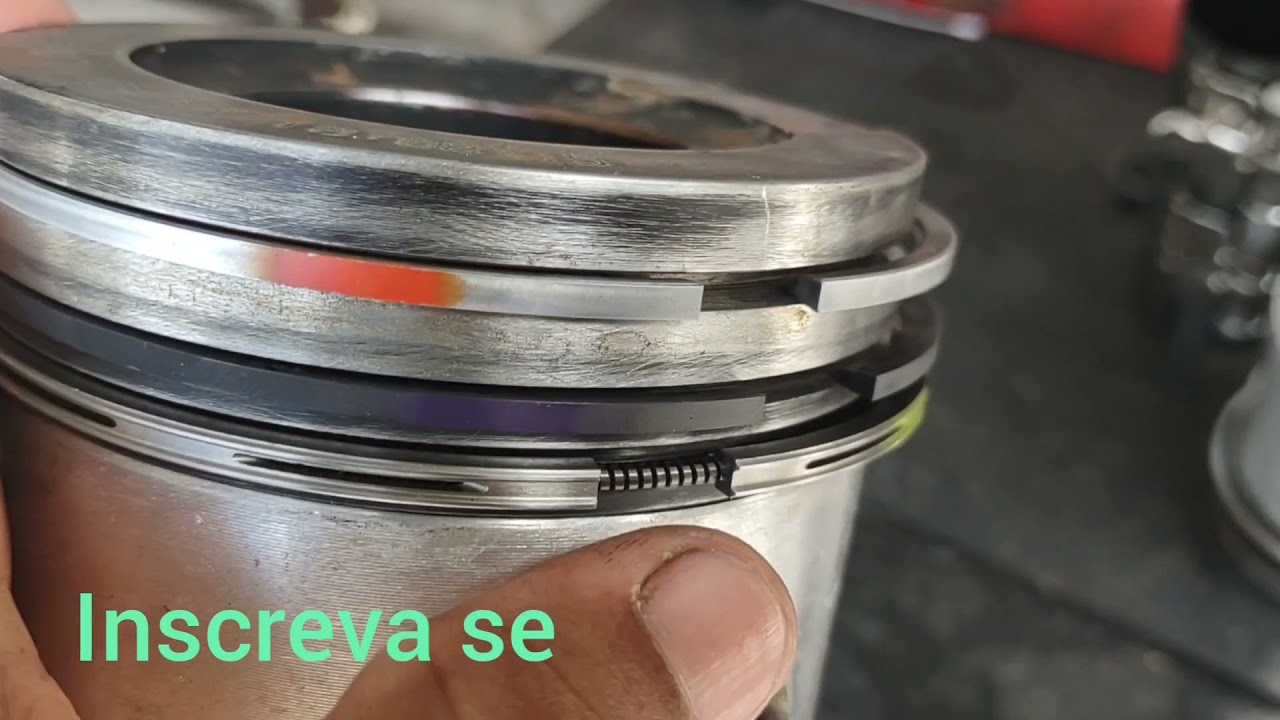 instalação dos anéis de seguimento no pistão motor Cummins ISL 400 constelletion