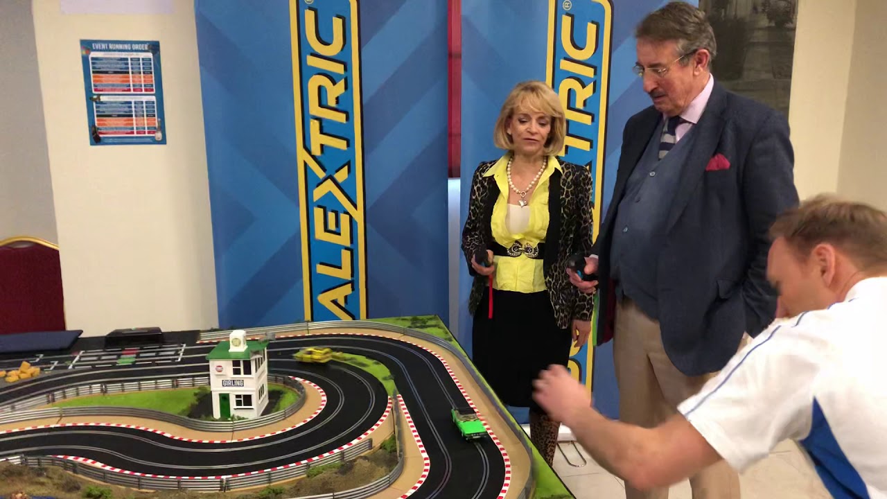 John Challis and Sue Holderness play Scalextric