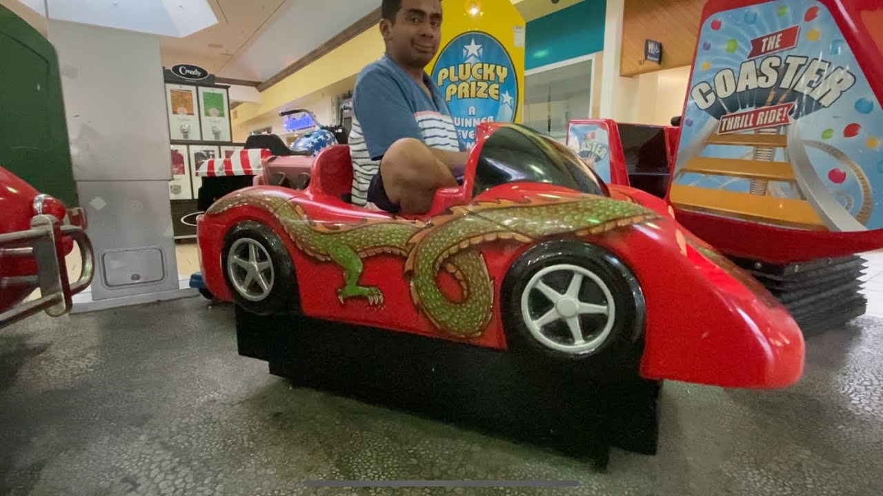Me riding Amutec Race car kiddie ride (slot car) part 37