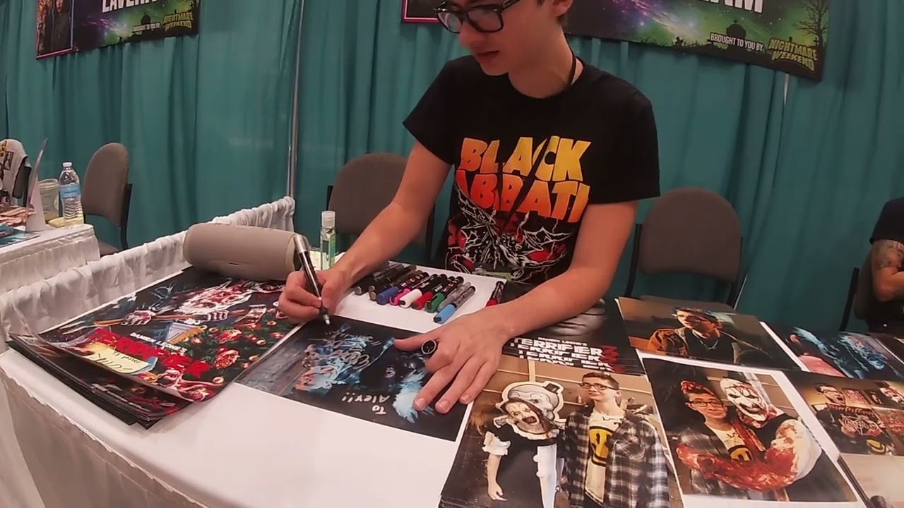 Elliott Fullam signing a Terrifier photo for me at GalaxyCon Raleigh North Carolina