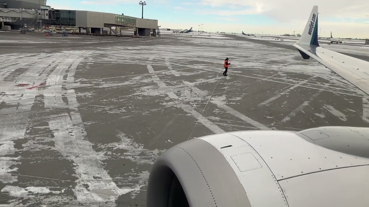 Westjet 634 pushback and engine start Calgary airport.