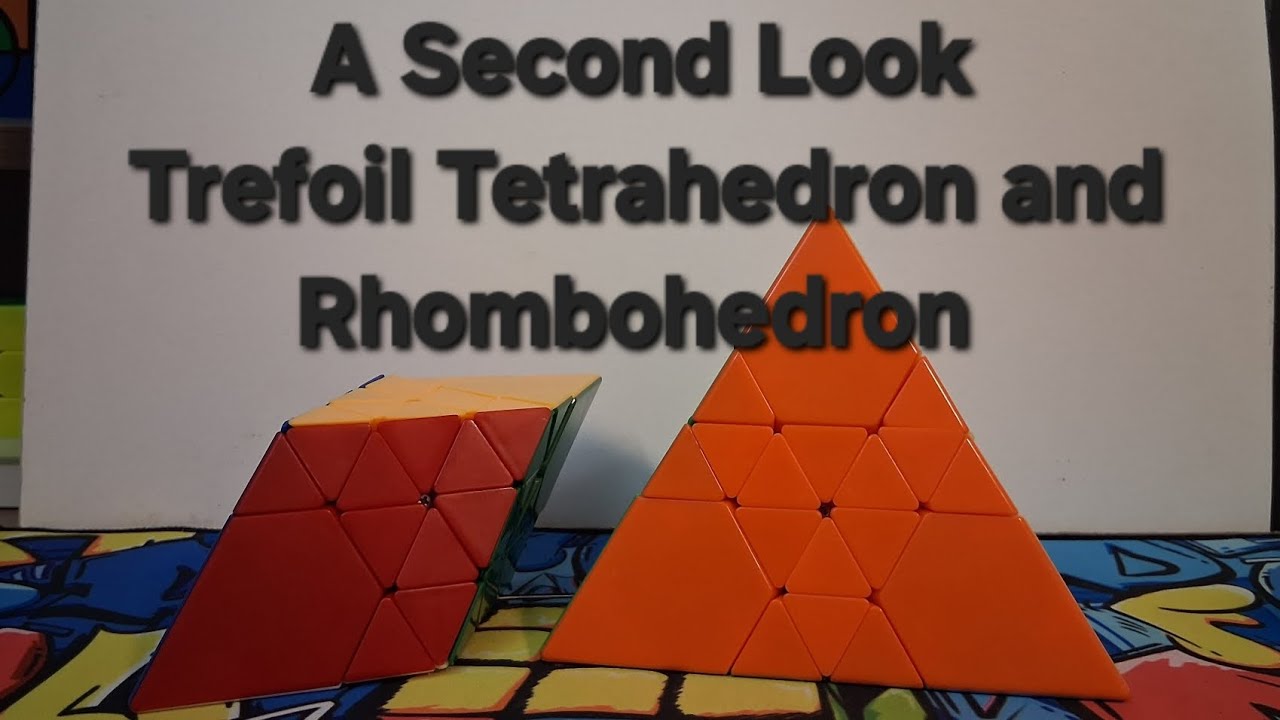 A Second Look at the Trefoil Tetrahedron and Rhombohedron Puzzles