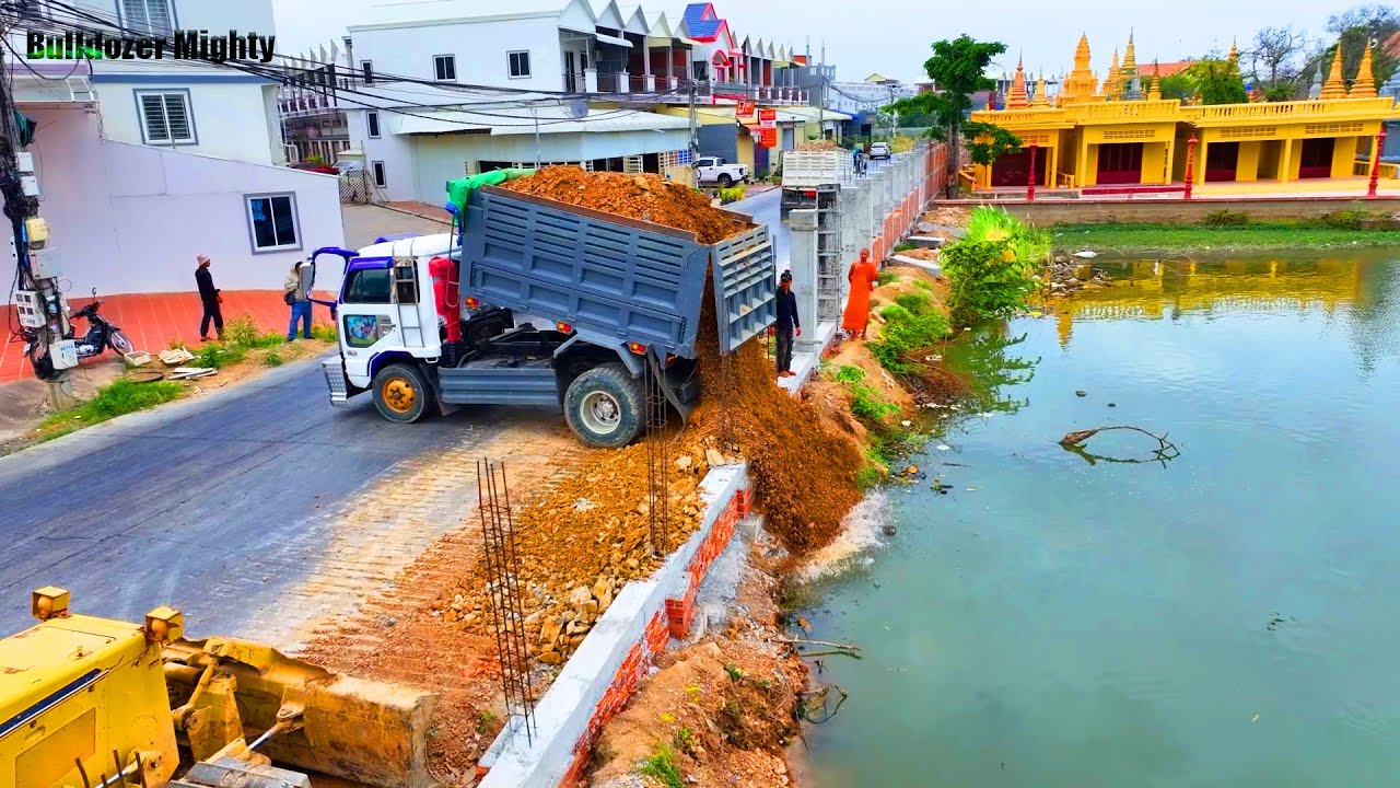 Skills​ Driver​ Machinery, Bulldozer KOMATSU, Dump Truck 25 Ton Unloading Stone Into Water