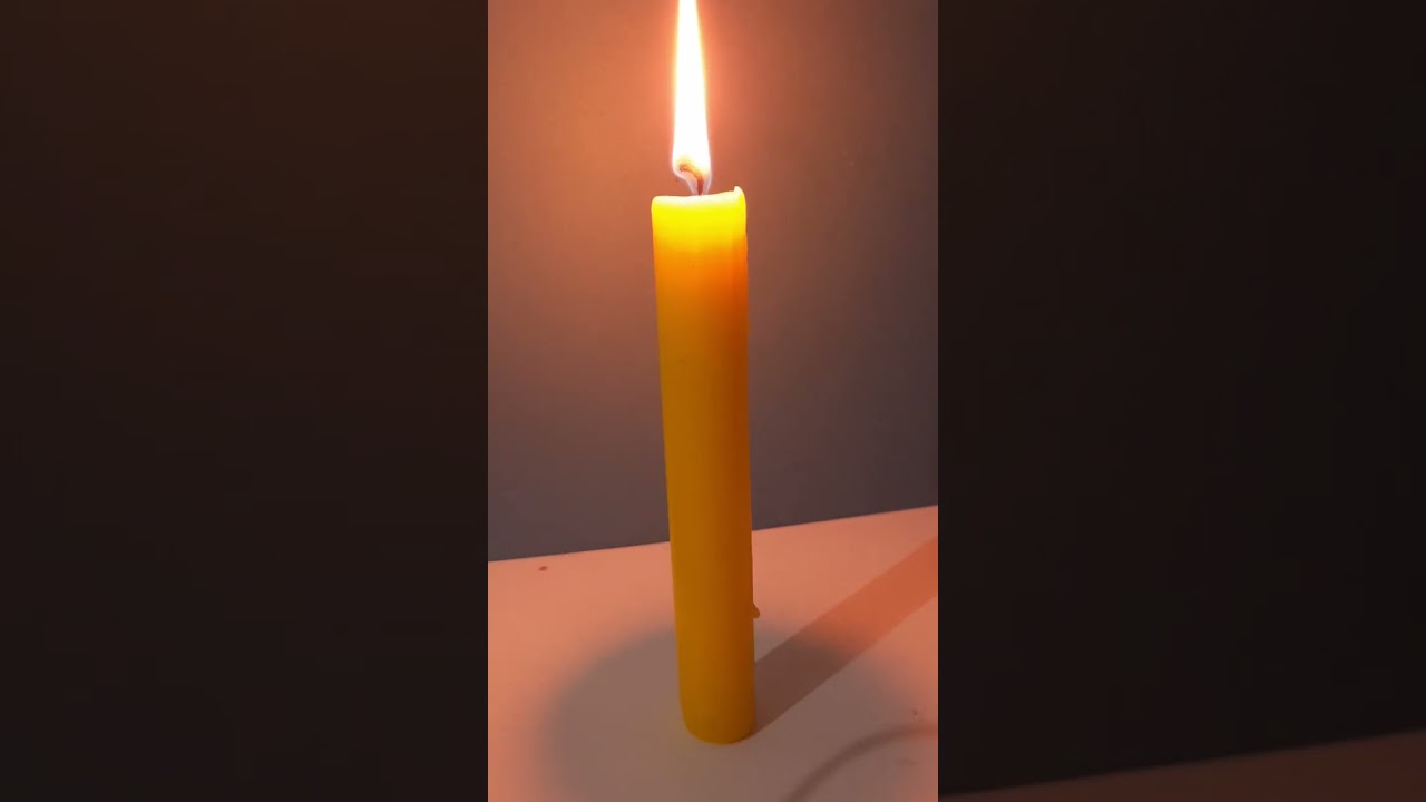 yellow candle burning | candle melting