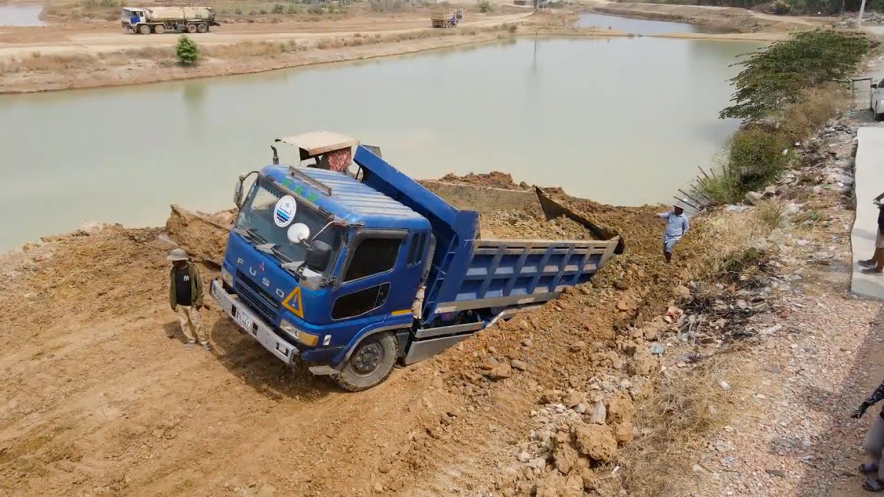 Be Careful​​!! Dump Truck Transport Soil Imprisoned in Deep Hole, Bulldozer To Build Road on canal