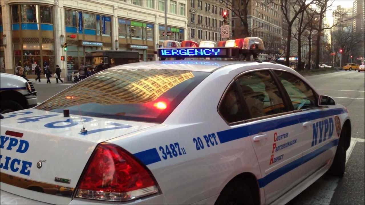 NYPD OFFICERS ARREST MOTORIST AFTER ALLEGEDLY FIGHTING WITH PEDESTRIAN ON WESTSIDE OF NEW YORK CITY.