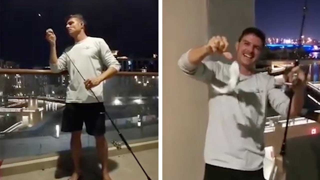 Bored Guy Goes Fishing Off Balcony