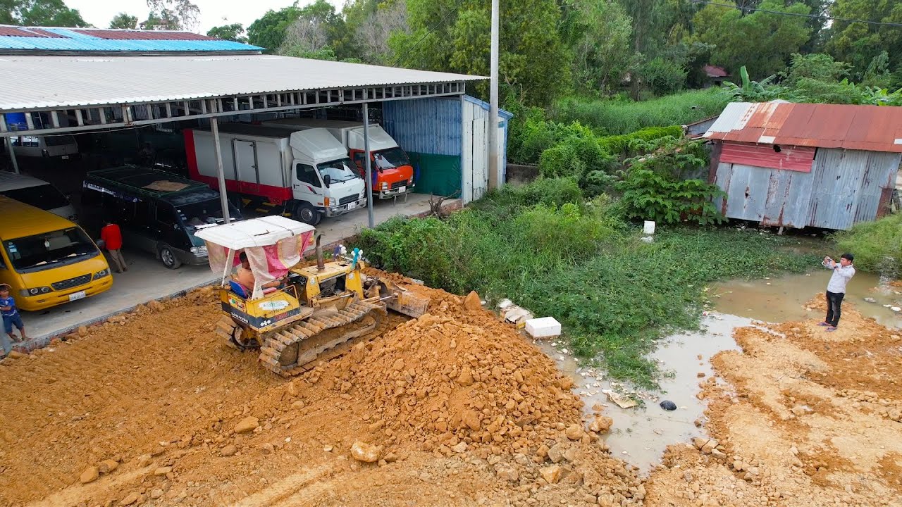 New Power Energy Bulldozer Operator Moving Dirt Dump Truck Unloading Dirt Processing Land Filling