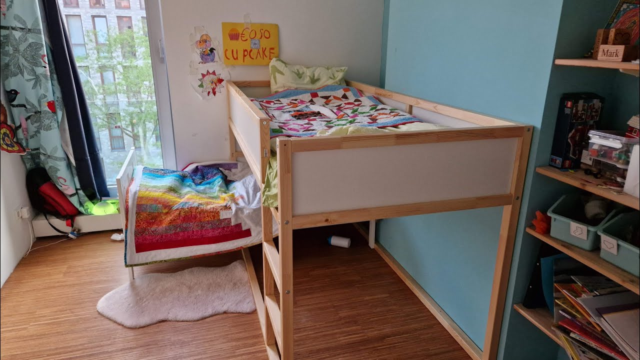 Assembling IKEA kura bed with children