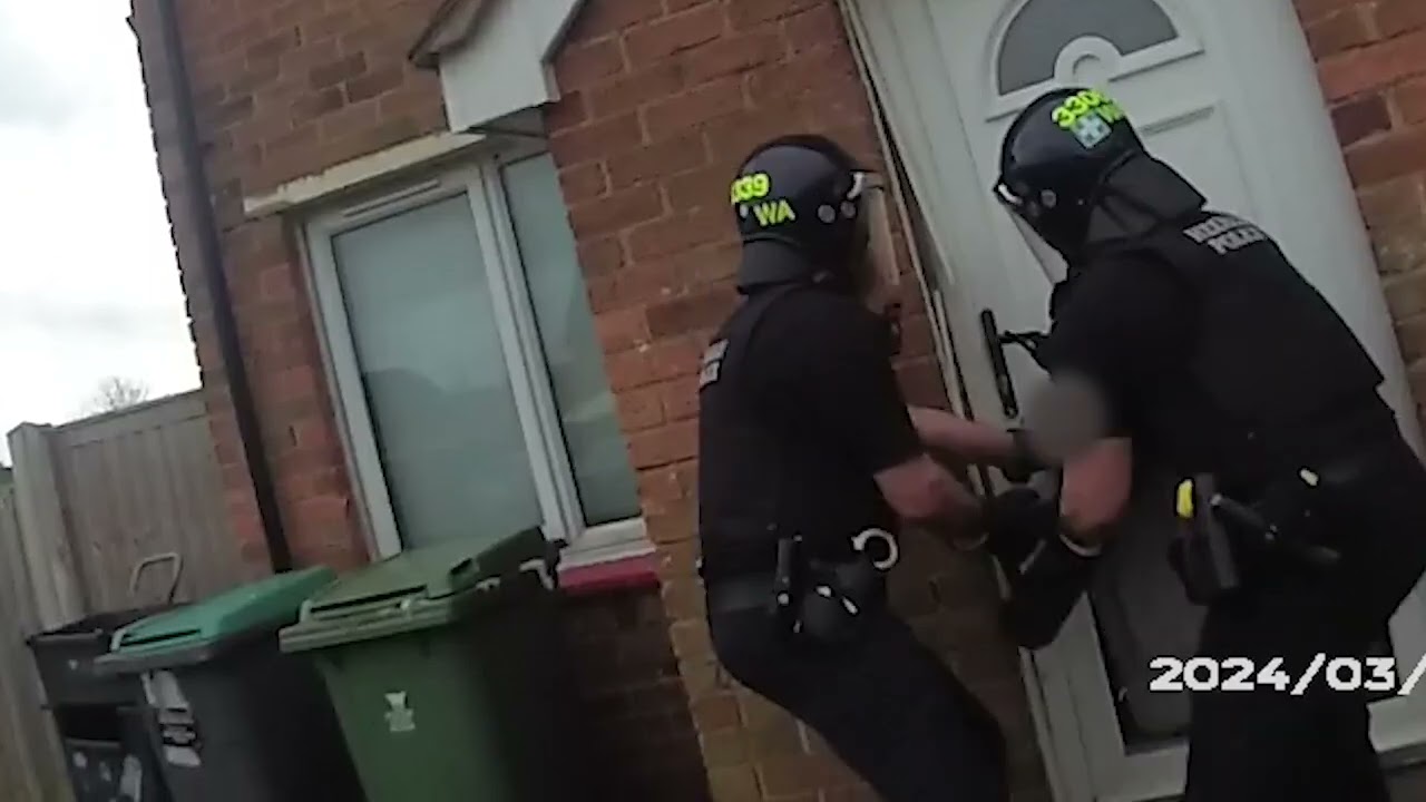 Officers execute a warrant in Wrexham