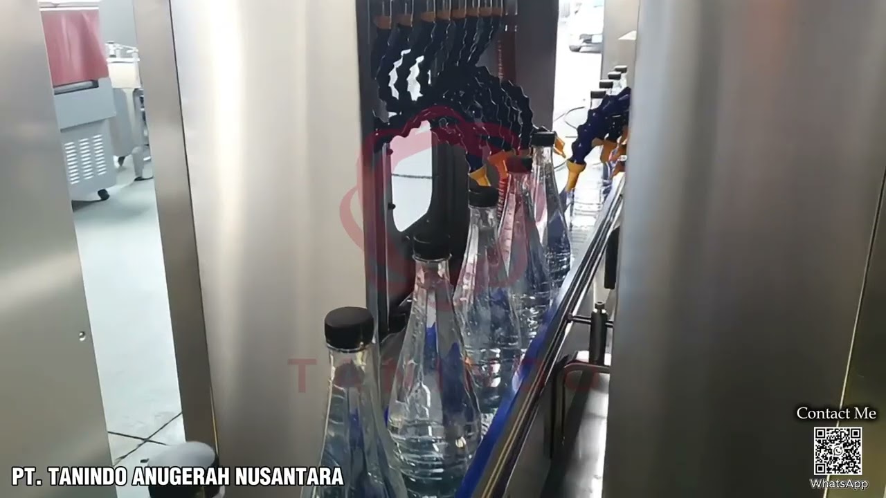 Mesin Washing, Filling dan capping bottle 5000BPH dan Automatic Sleeve Labelling dan Shrink Tunnel.