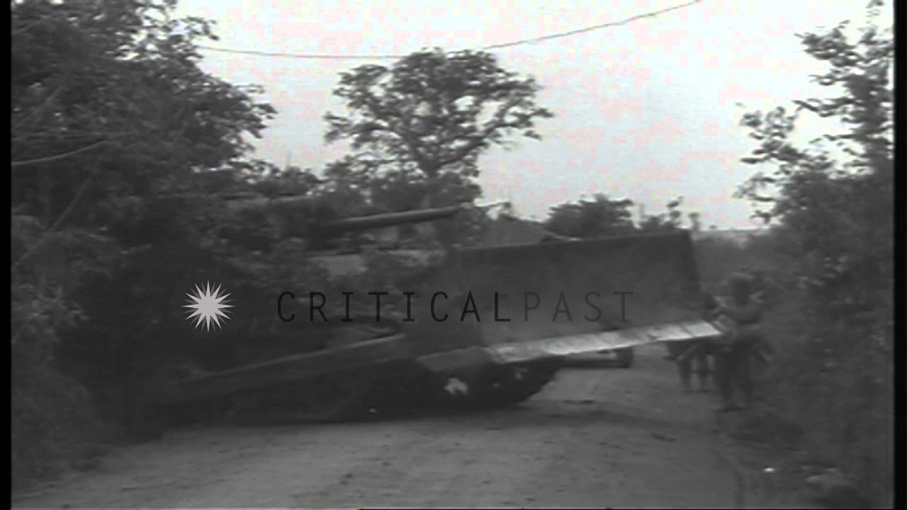 US 4th Division, 8th Infantry, 3rd Battalion soldiers and tanks move along a road...HD Stock Footage