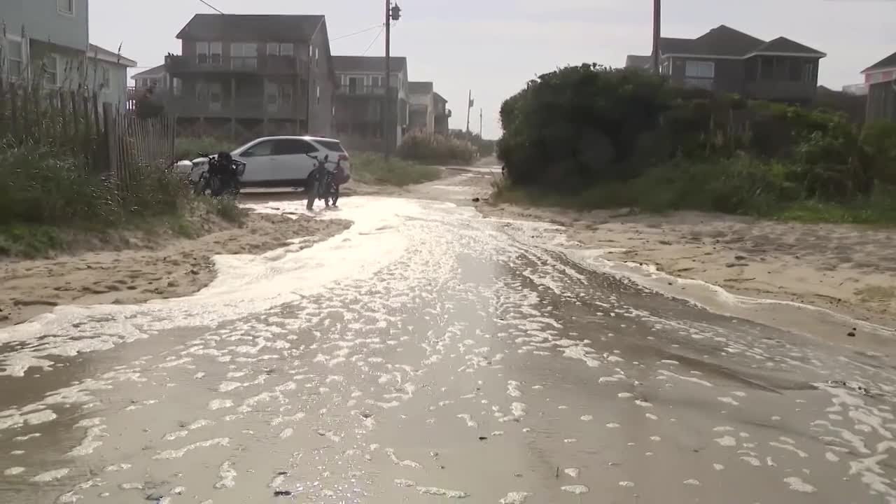 Hurricane Erin stirs up strong winds and floods part of NC highway as it slowly moves out to sea