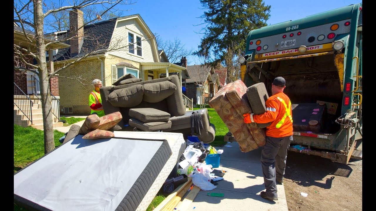 Piles of trash and furniture left by departing students