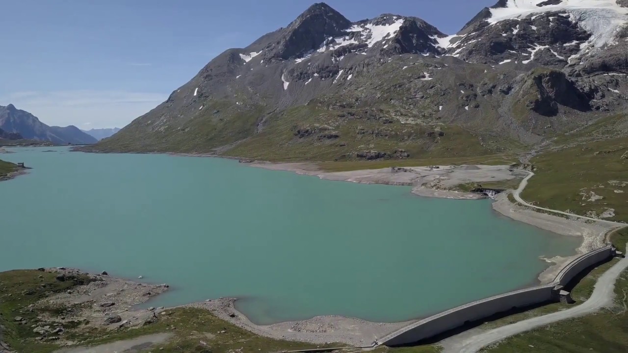 Aerials footage by drone of Bernina pass anche white lake. (Switzerland)