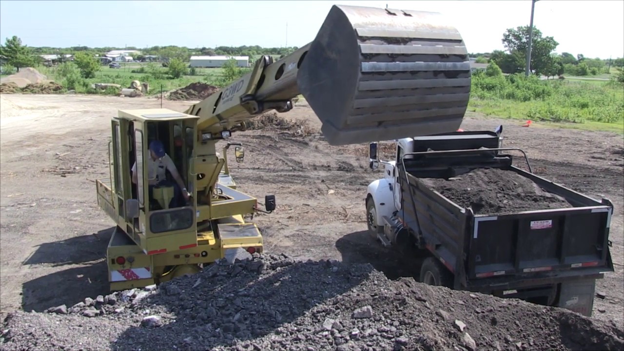 TxLTAP Loading a dump truck with a Gradall