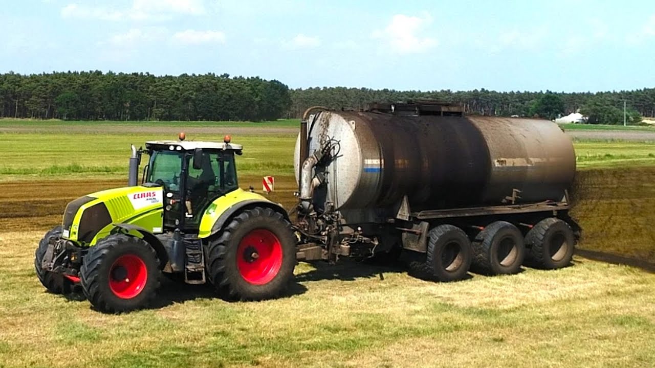 Grasland bemesten met een werkbreedte 14 Mtr. met Claas.