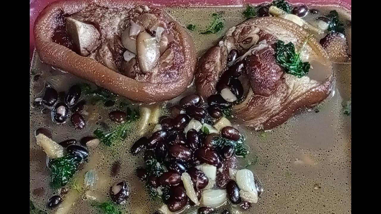 Pork Pata soup with dried black beans and ampalaya leaves