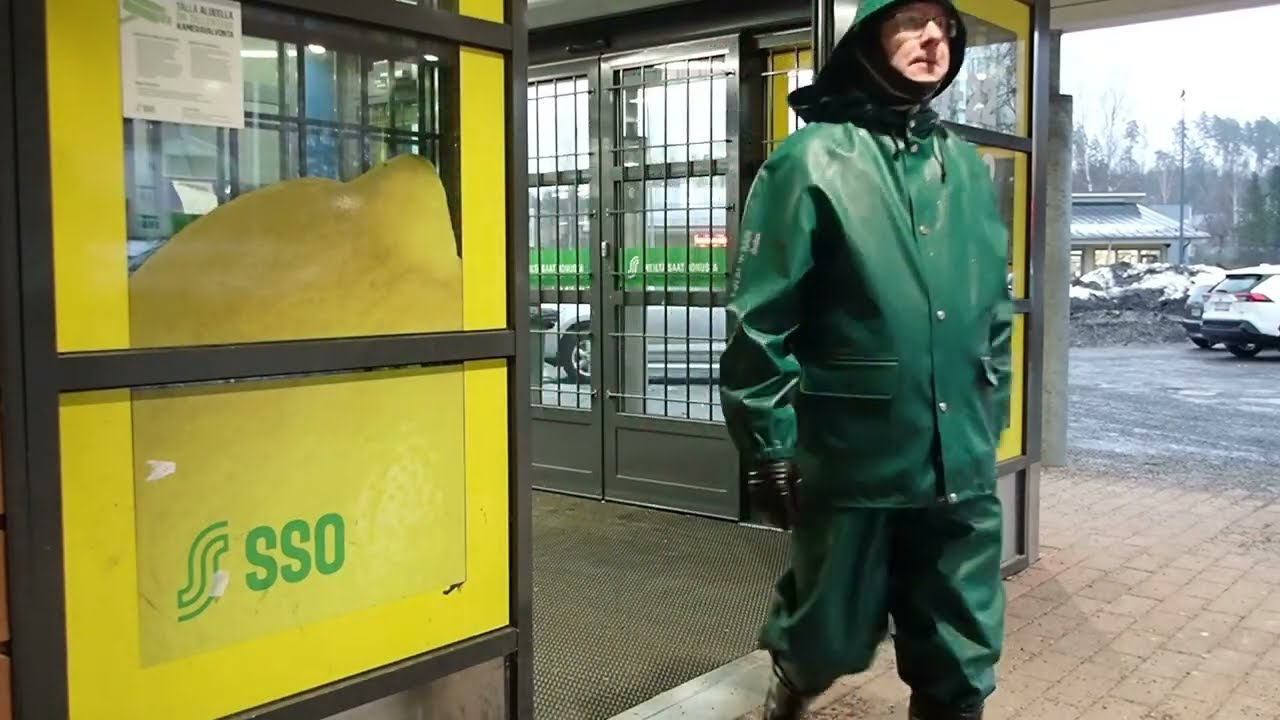 winter walk in green rainwear