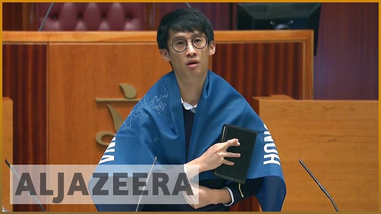 Hong Kong MPs defy China during swearing-in ceremony