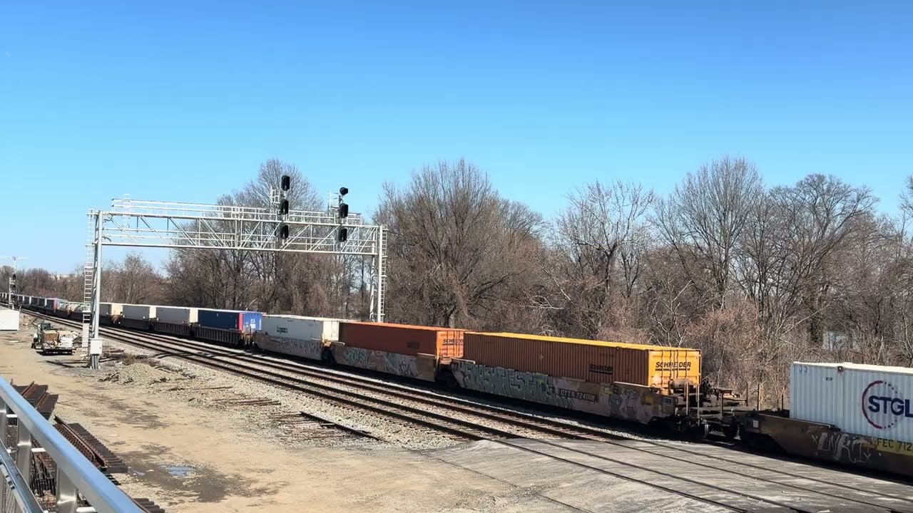 CSX 4585 and AMTK 303 lead trains at Long Bridge park Arlington Virginia.