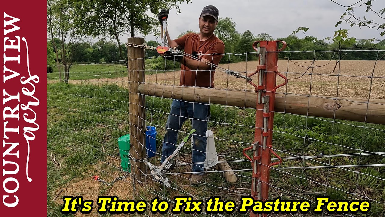 Installing the Livestock Fence over where the old trash pit was filled in.