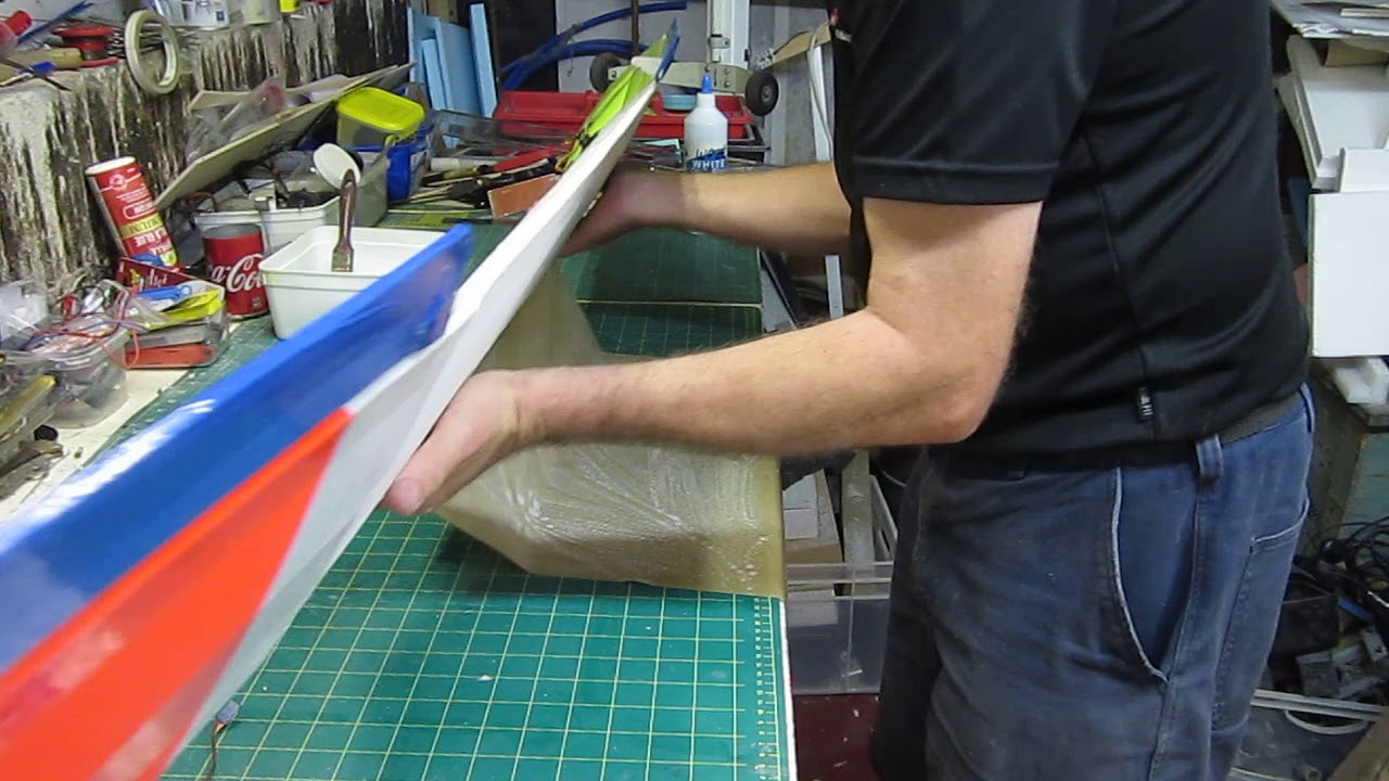 Covering a foam wing with brown packaging paper
