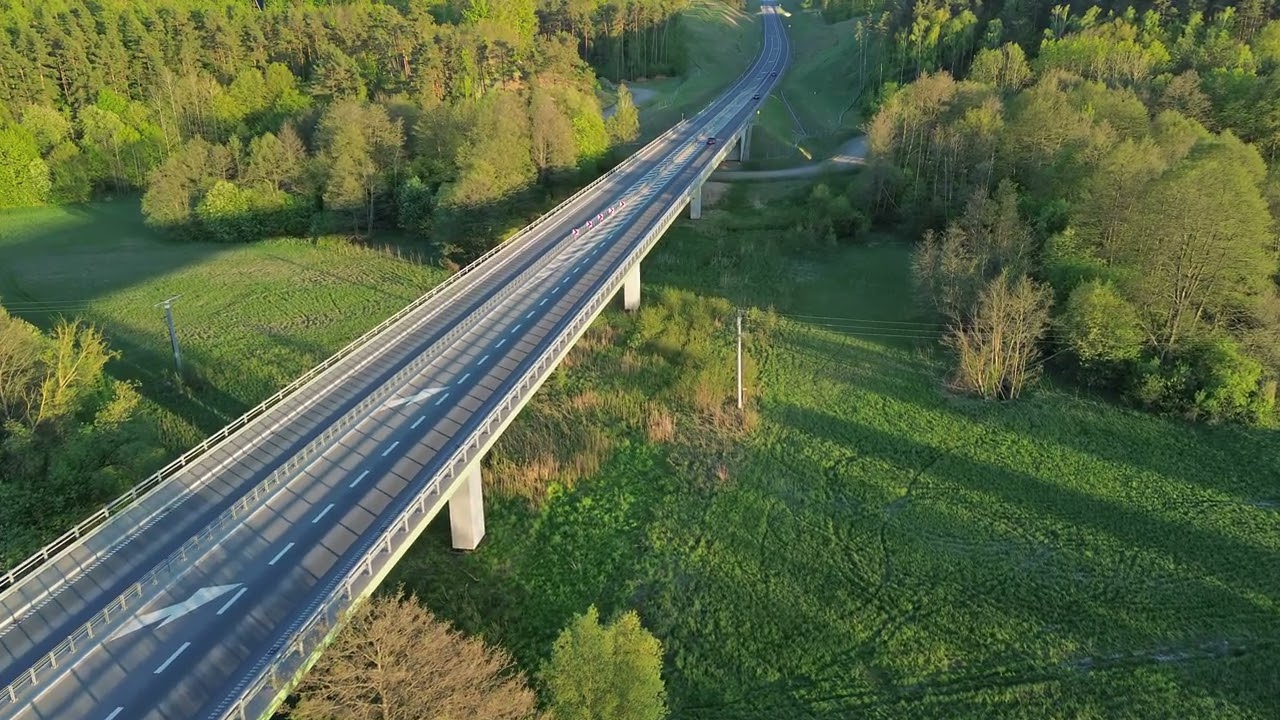 Aerial View of Road, Forest and Lakeside Countryside Landscape &ndash; 4K ProRes