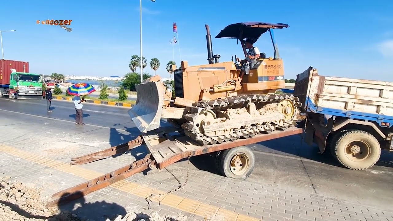 Start project landfill by using bulldozer d31P working push clean soil with dump truck 5T unloading