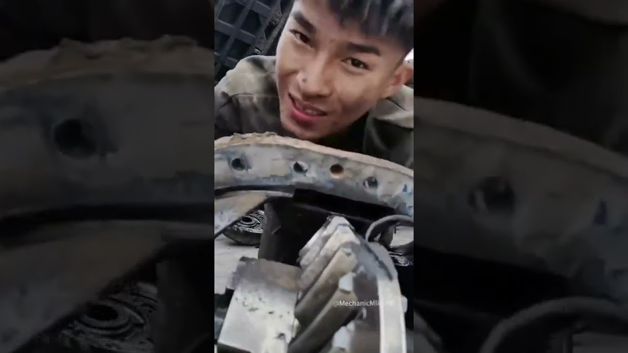 Young man truck differential repair.
