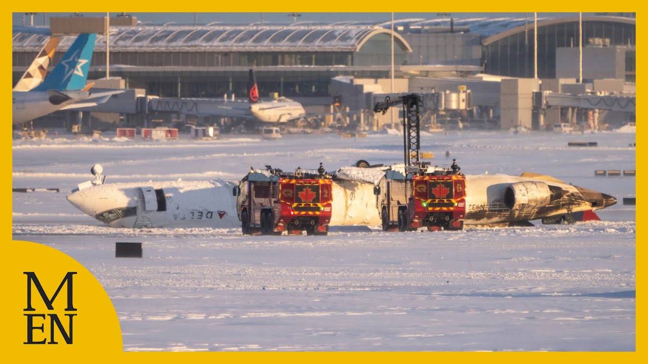 Plane flips upside down as it crash lands at Toronto airport in Canada