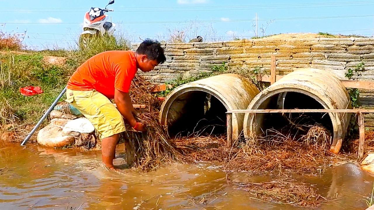 Remove Debris Clogged Twin Culvert