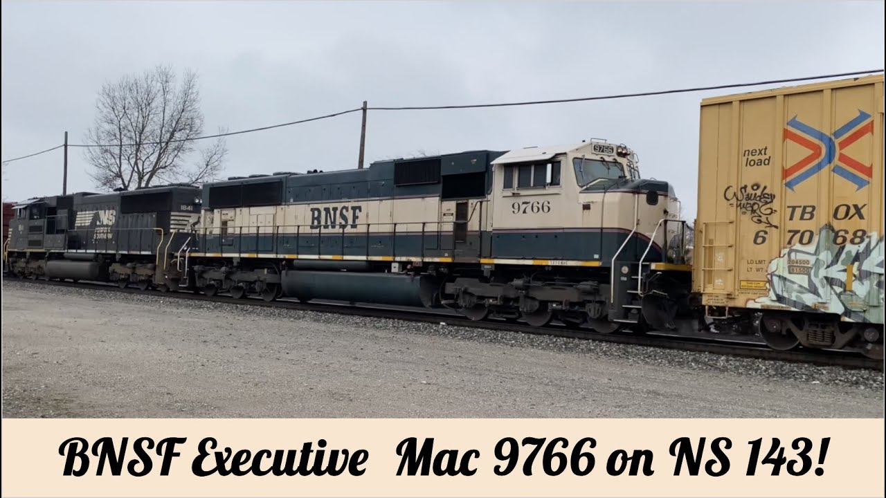 BNSF Executive Grinstein Mac 9766 on NS 143 as DPU