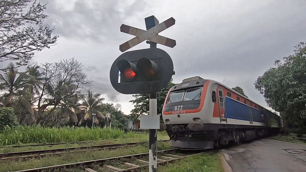 Podi Menike Express Train Railroad Crossing near Wanawasala Railway Station in Sri Lanka