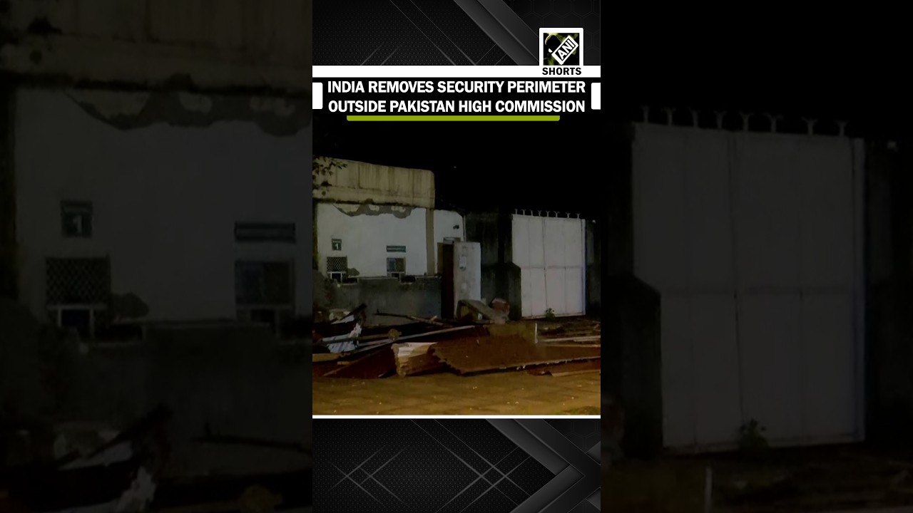 Indian authorities dismantle the external security perimeter outside the Pakistan High Commission