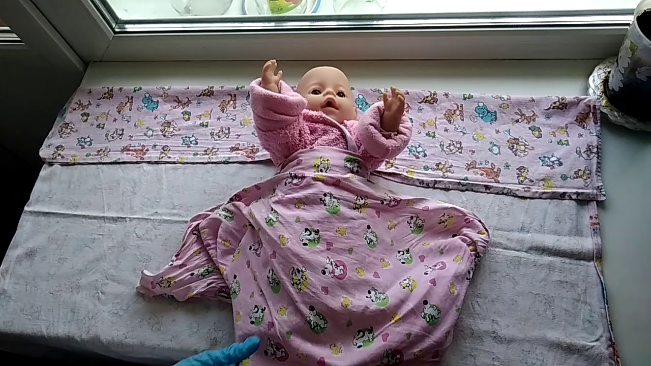 Пеленание новорожденного