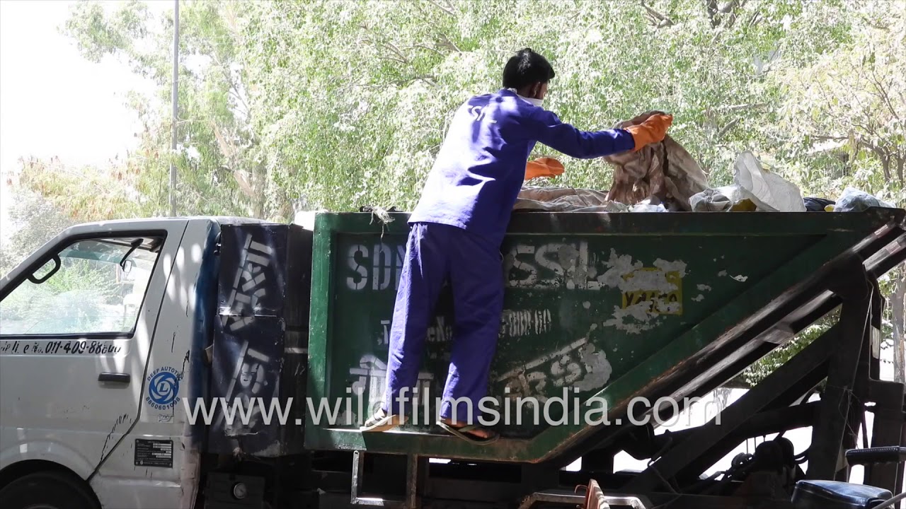 Ragpicking inside a garbage lorry of SDMC in New Delhi