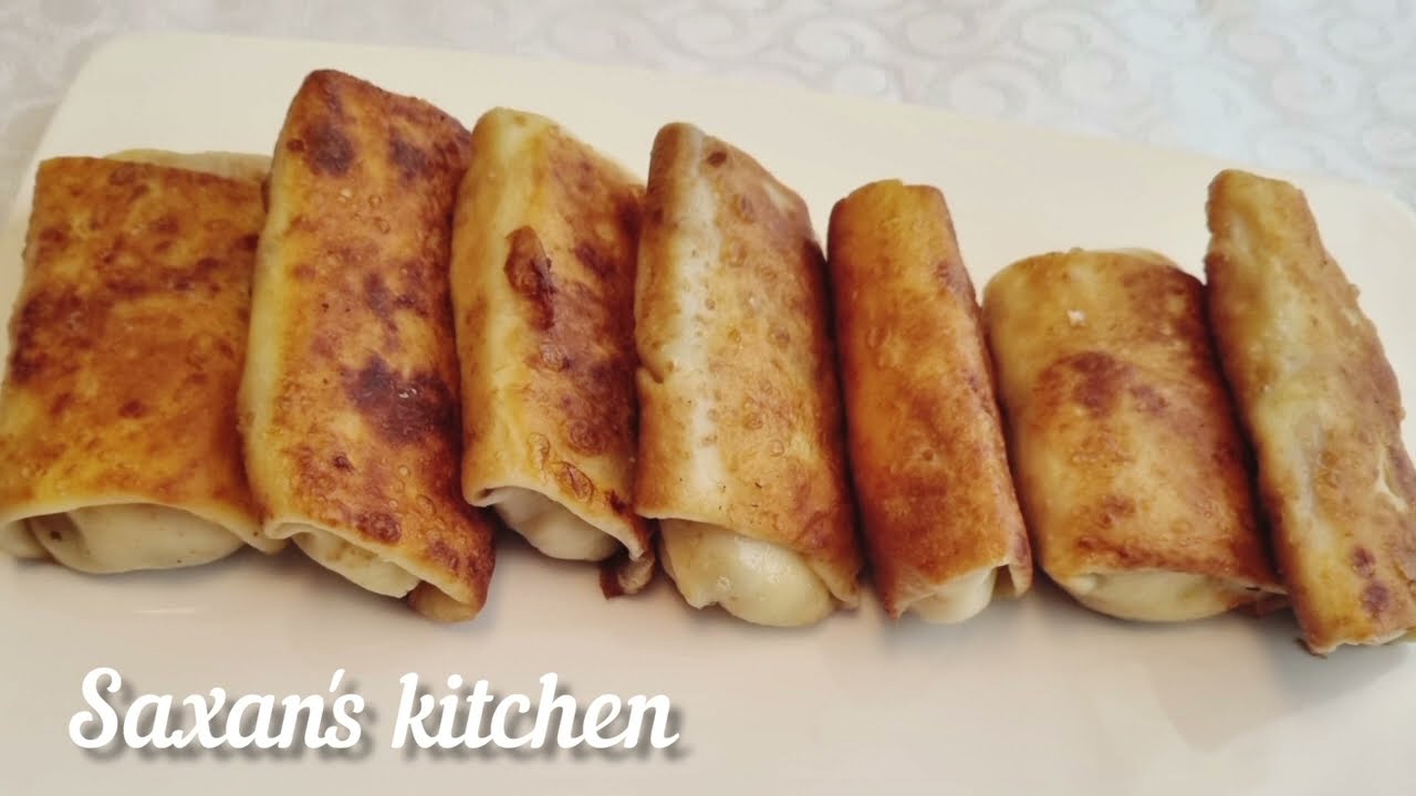 Kəsmikli və kişmişli blinçiklər.Блинчики с творогом и uзюмом.