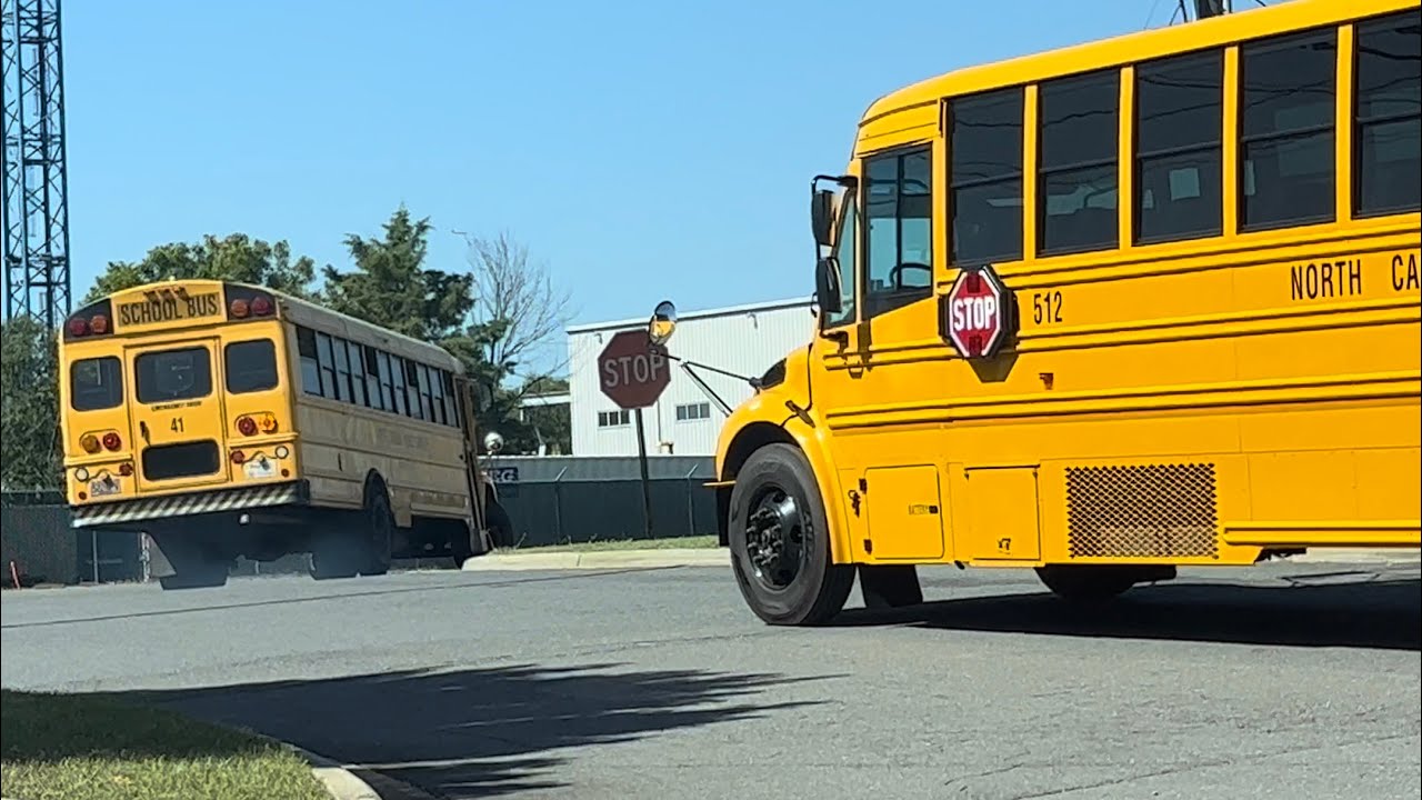 School Buses Pulling Out of Garage | Mecklenburg County | Completion