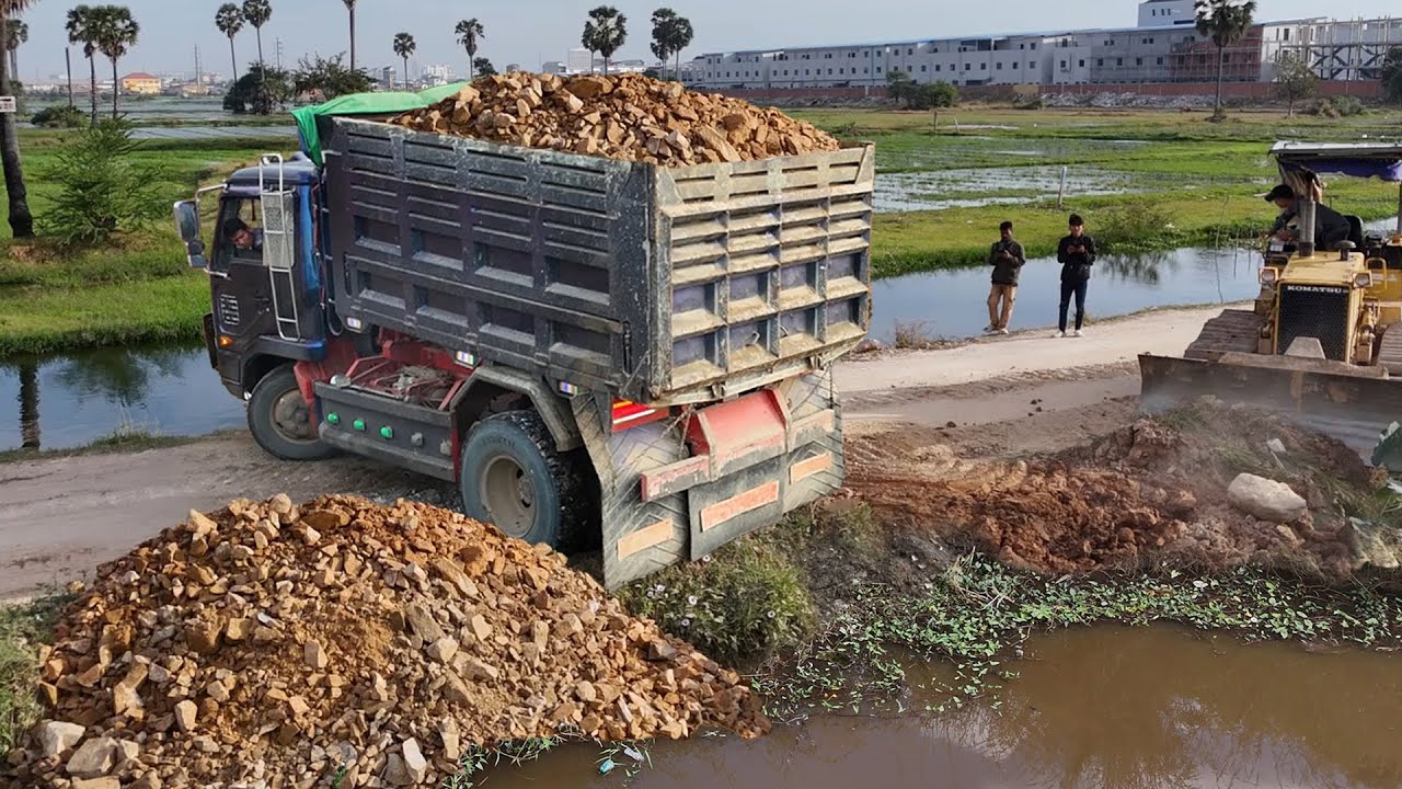 Nicely first process!! Massive size filling land by great teamwork NISSAN truck & KOMATSU dozer