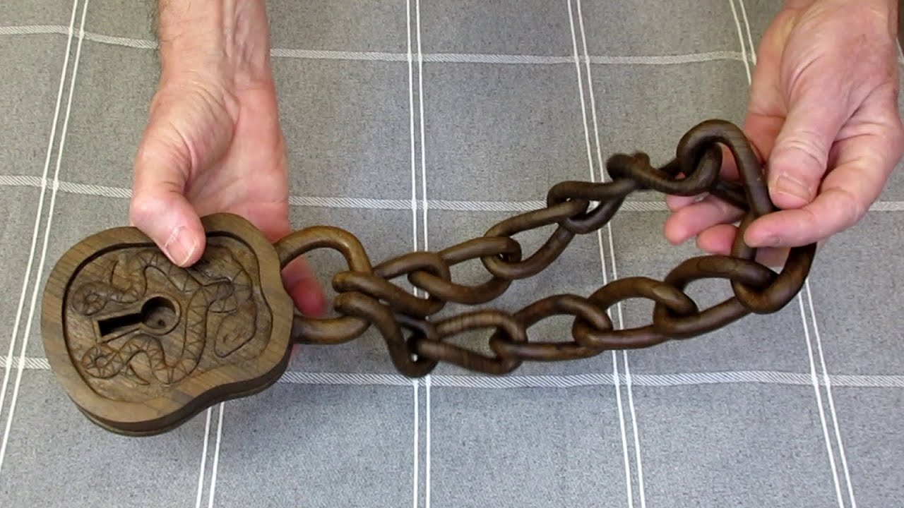 Carved wooden padlock and twisted chain