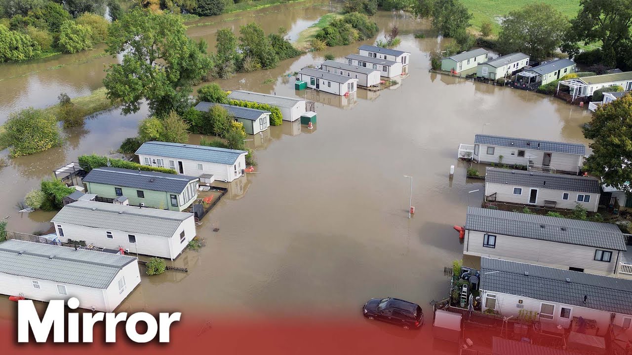 Flood warnings issued for rain across UK as holiday park evacuated