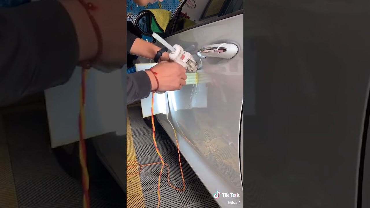 Repairing automobile depressions with hot-melt glue sticks