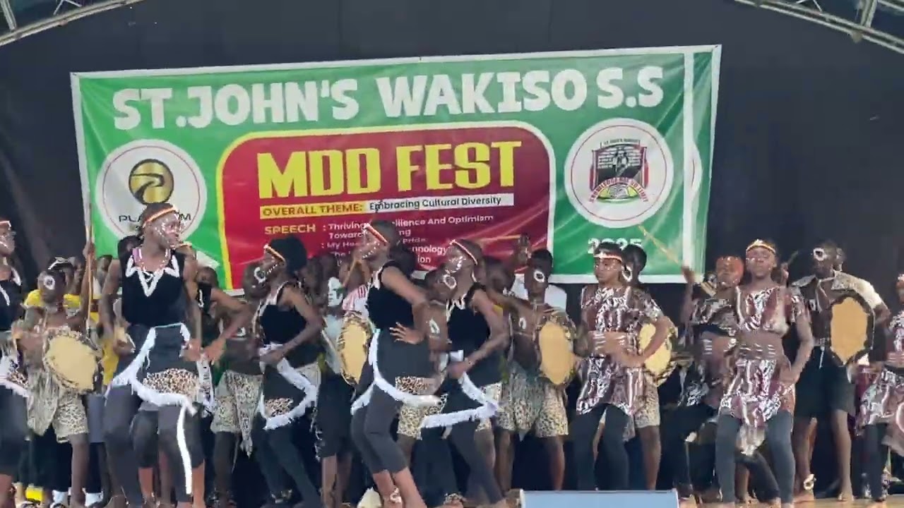 Acholi traditional dance by yellow house