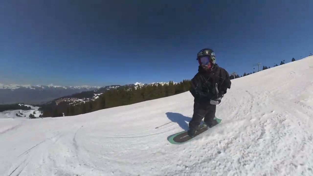 Snowboarding in Villars-Gryon — carving down the piste with stunning Swiss Alps views